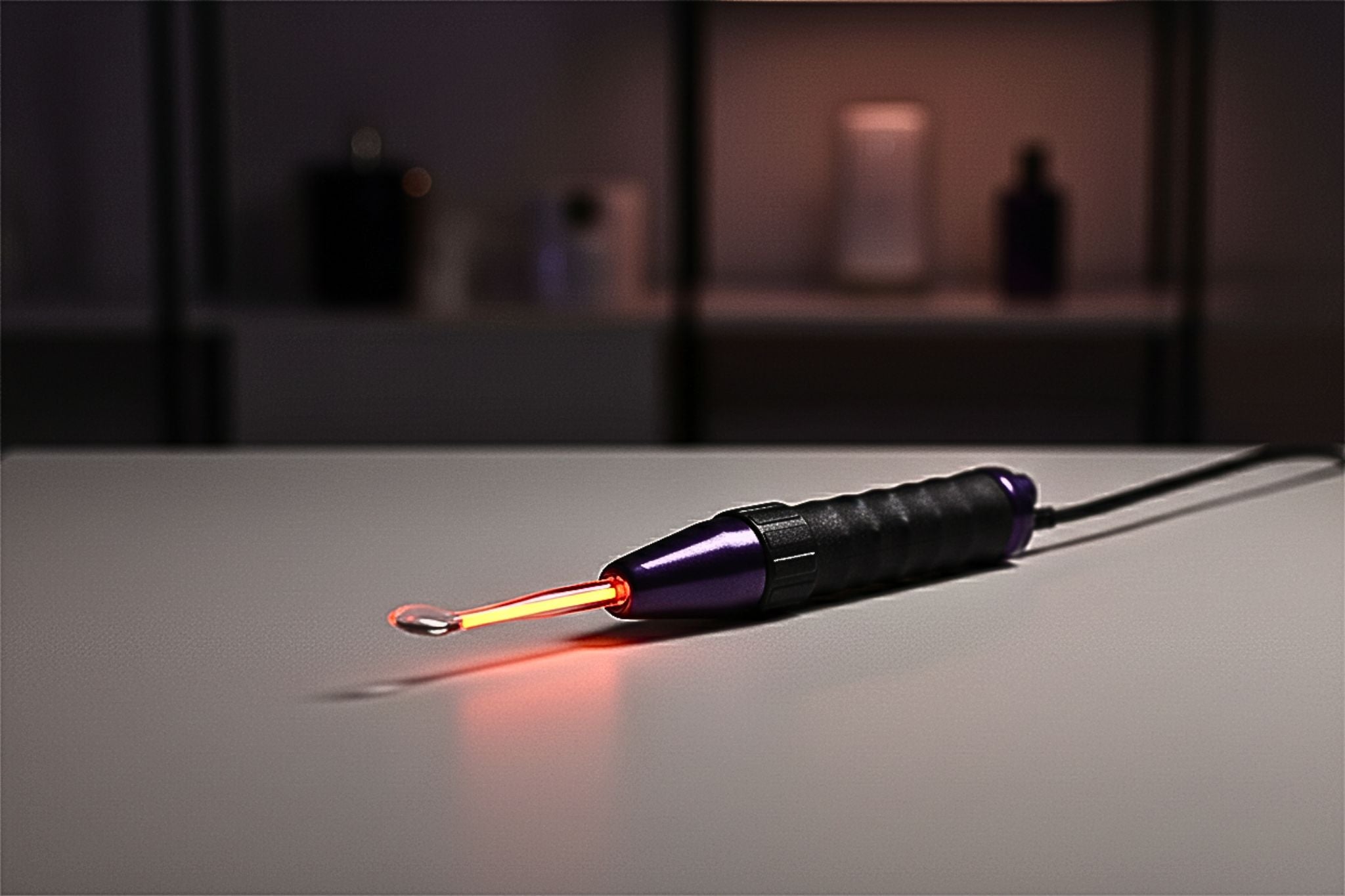 High-frequency therapy wand glowing neon red-orange, designed for neuro-inclusive pelvic wellness.