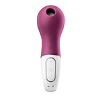 A front view of the purple and white Lucky Libra massager, highlighting the transition from the soft, purple Air-Pulse Tech head to the adaptable grip handle, featuring the magnetic USB charging port.