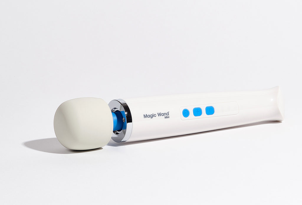 A white Magic Wand Mini wellness device on a white background. Highlighting the soft control buttons and easy grip handle. Gender neutral and Medical-Grade silicone for Adaptive Sensory Comfort.