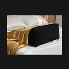 Adaptive intimacy positioning wedge in matte charcoal with gold drape for ergonomic wellness.