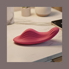 App-controlled wearable wellness device close-up detailing soft pink silicone texture.