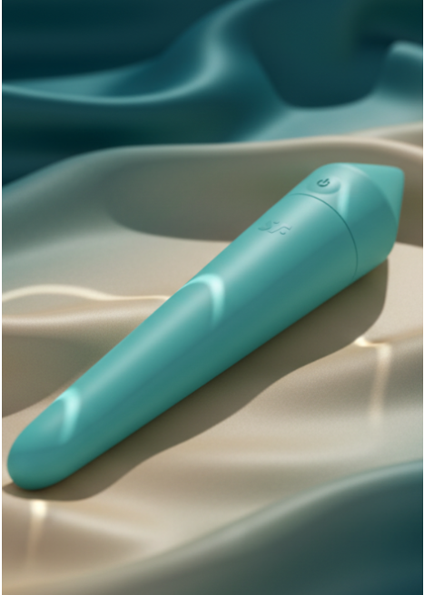 Close-up of a matte turquoise compact wellness device resting on luxurious, rippling silk that transitions from deep teal to pale gold. Shimmering, aquatic light reflections are dappled across the device and fabric, highlighting its sleek, waterproof design and sensory focus.