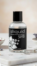 Close up of Sliquid Silver 4.2 oz bottle on marble for long-lasting menopause support.
