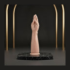 Ergonomic hands-free dilation tool displayed on a black marble plinth for pelvic wellness.