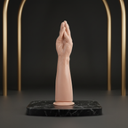 Ergonomic hands-free dilation tool displayed on a black marble plinth for pelvic wellness.