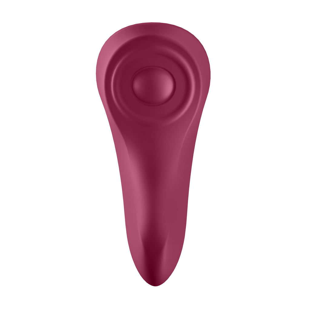 Front-facing view of a berry-red silicone wellness tool, showcasing its wide, circular Discreet Sensory Pulse pad and ergonomic, body-contoured shape.