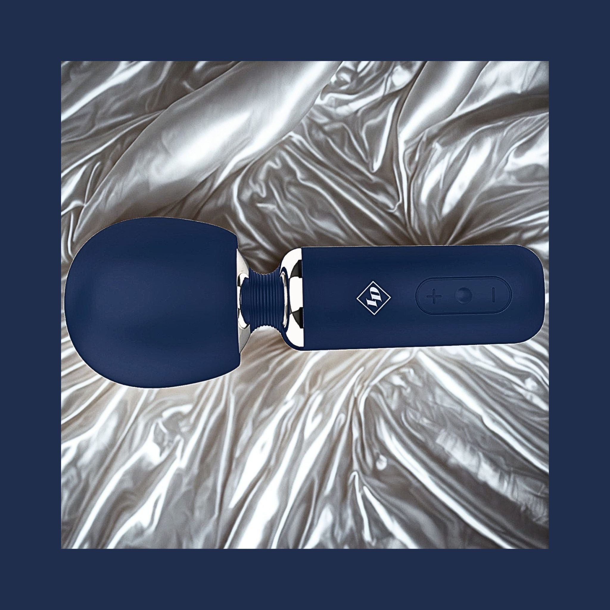 Give Into Me Wellness Wand for Flexible Percussive Care, shown on a luxury bedspread, highlighting its Ergonomic Stability Grip and flexible neck.