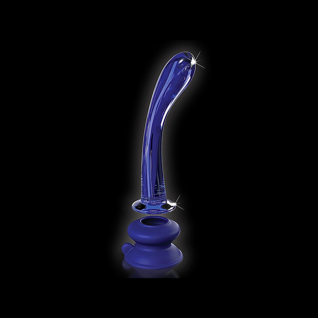 Harness-compatible glass wand hovering above its silicone mounting base for independent use.