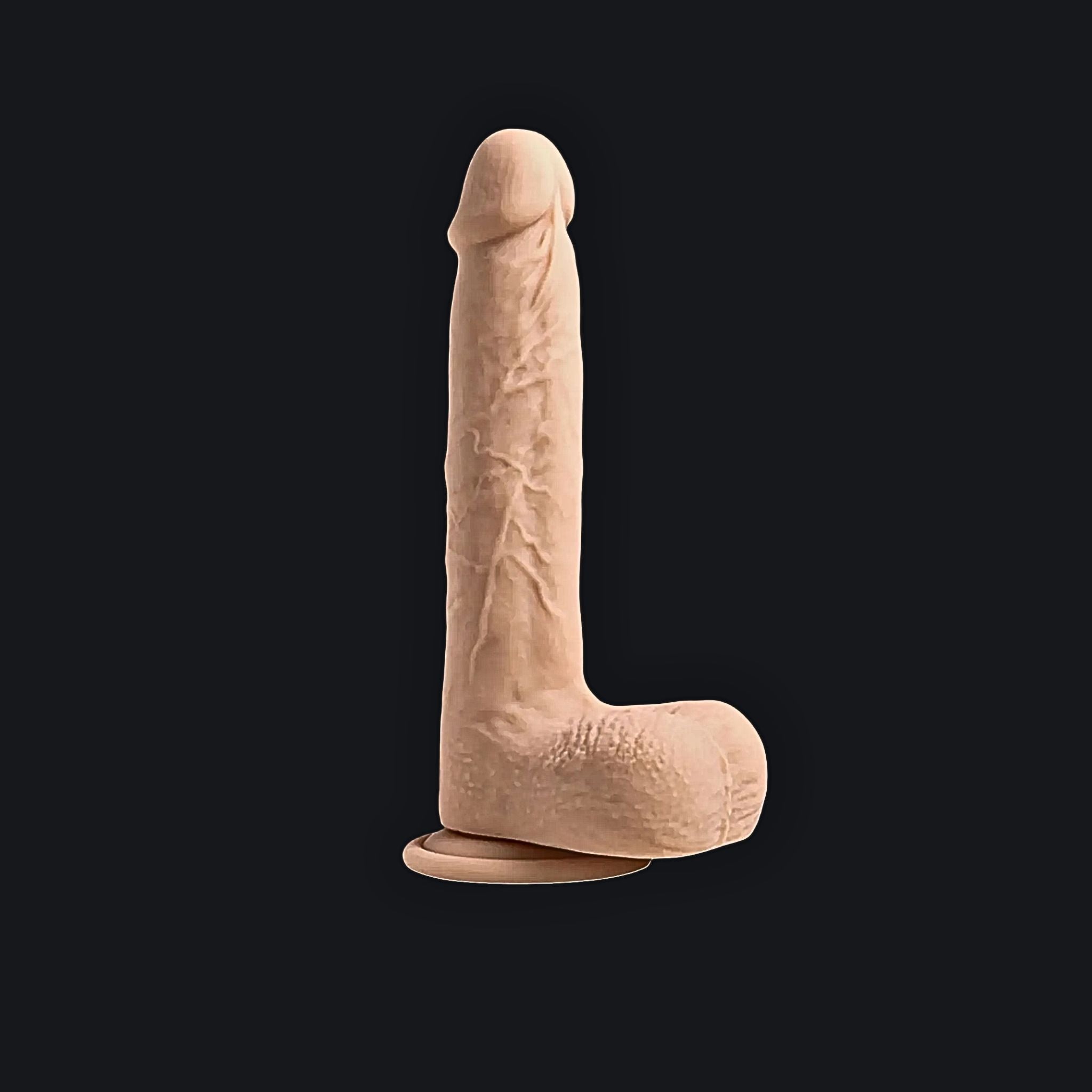 Heated adaptive sensory massager in soft beige displayed with a secure hands-free base in a dark background.