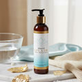 Sliquid Balance Splash Unscented luxury display on marble with gold leaf and blue silk. Gentle, pH-balanced intimate wash pump bottle, 8.5 fl oz.