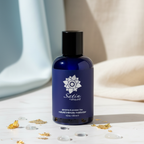 Sliquid Satin bottle with vegan organic aloe hydration moisturizer for reliable physical comfort in a soft layout surrounded by gold flakes.