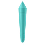 The back view of a turquoise silicone wellness tool, highlighting its seamless, waterproof design and two small magnetic USB charging ports near the base.